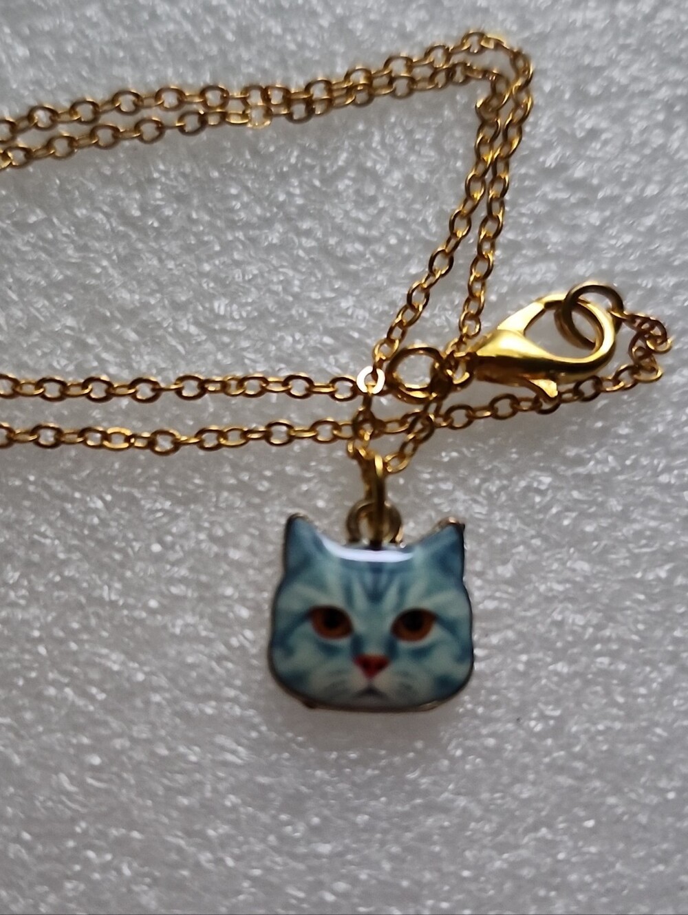 Hand Crafted Gold-tone Necklace with Blue Cat Face Pendant